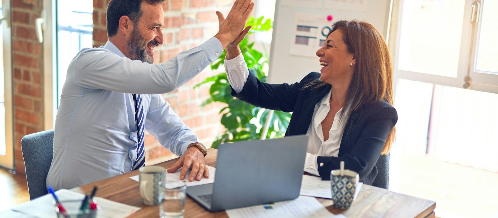 Colleagues together at work, representing group employee protection